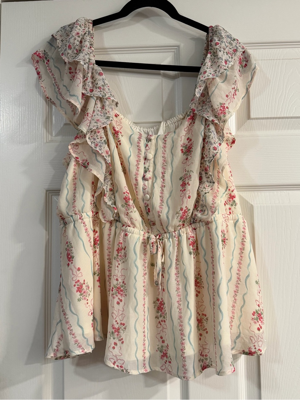 Torrid Cream Floral Ruffle Peplum Top with Pink and Blue accents